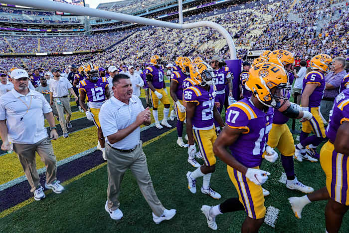 LSU Head Coach and LSU Headed to Locker Room